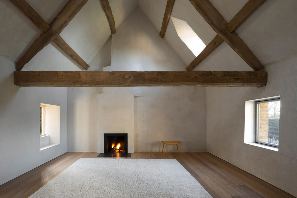 minimal bedroom with chimney and wood structure