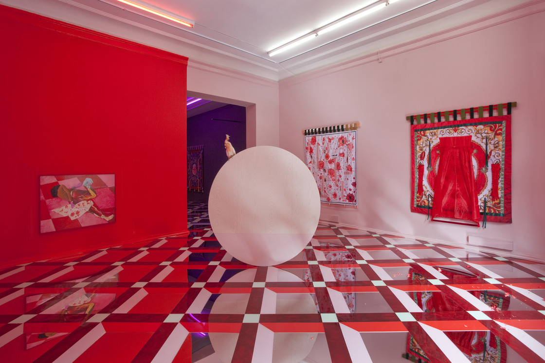 installation, red space, texture on floor, red wall, paintings